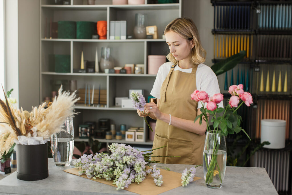 Small business. Female florist in flower shop.